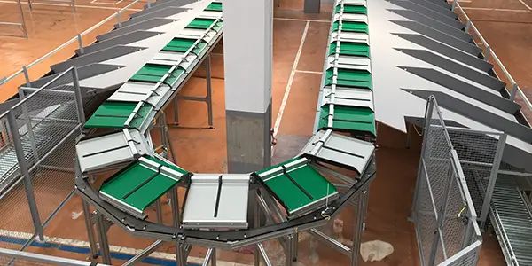 Sorting shoes and clothing with a Push Tray and Split Tray Sorter
